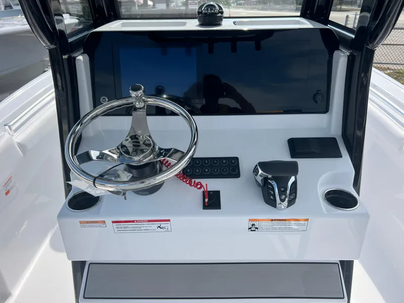 Slide: The Image of 2025 Sportsman Open 212 Center Console dashboard with steering wheel and controls. - 11