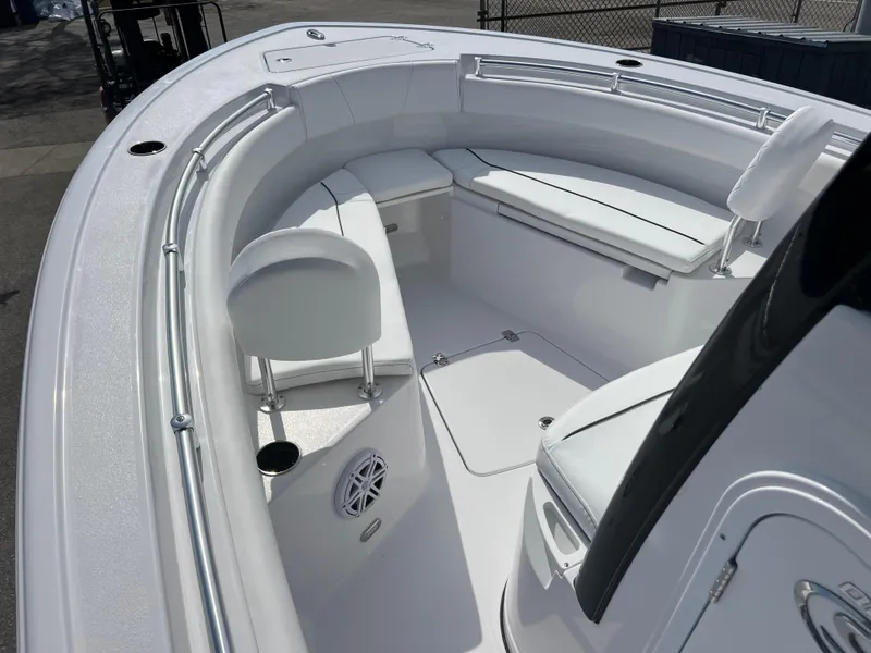 Slide: The Image of 2025 Sportsman Open 212 Center Console boat interior with white seating and modern design. - 13