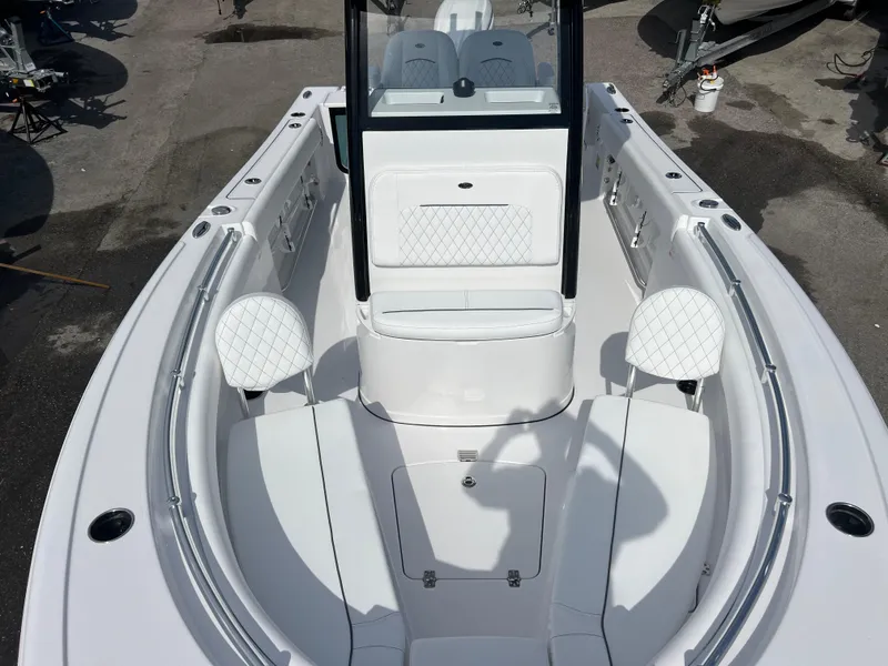 Slide: The Image of 2025 Sportsman Open 212 Center Console boat interior with white seating and sleek design. - 15