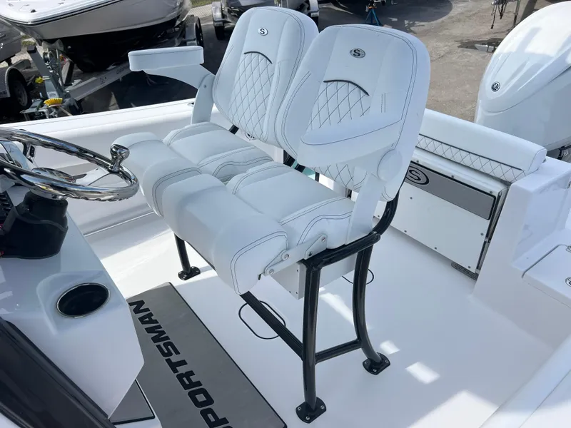 Slide: The Image of 2025 Sportsman Open 212 Center Console with dual white cushioned seats and steering wheel. - 17