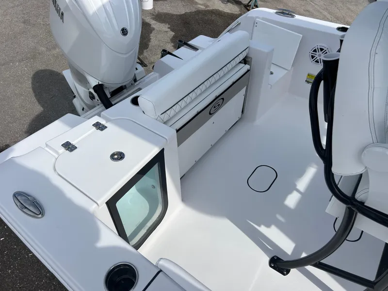 Slide: The Image of 2025 Sportsman Open 212 Center Console boat interior with seating and storage features. - 18