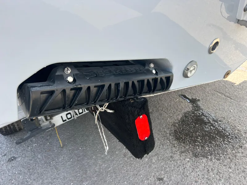 Slide: The Image of 2025 Sportsman Open 212 Center Console boat with a keel protector on a trailer. - 6