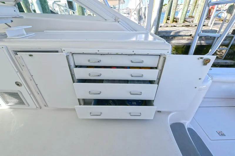 Slide: The Image of 2007 Cabo 40 Express helm with tower, featuring dual captain chairs and advanced navigation equipment. - 10