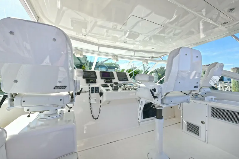 Slide: The Image of Control panel of a 2007 Cabo 40 Express with Tower, featuring navigation and communication equipment. - 11