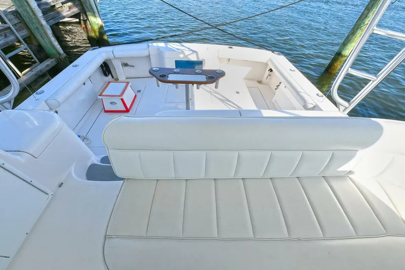 Slide: The Image of Luxurious interior of 2007 Cabo 40 Express yacht with leather seating and wooden finishes. - 15