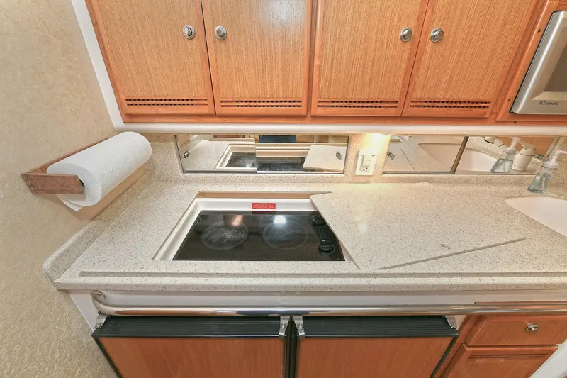 Slide: The Image of Electrical control panel inside 2007 Cabo 40 Express with Tower, featuring gauges and switches. - 23