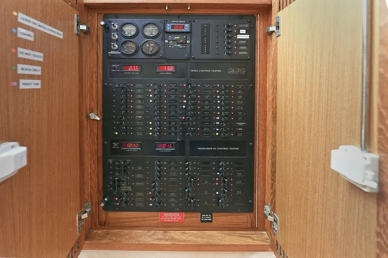 Slide: The Image of Engine compartment of a 2007 Cabo 40 Express with Tower, showcasing detailed mechanical components. - 24