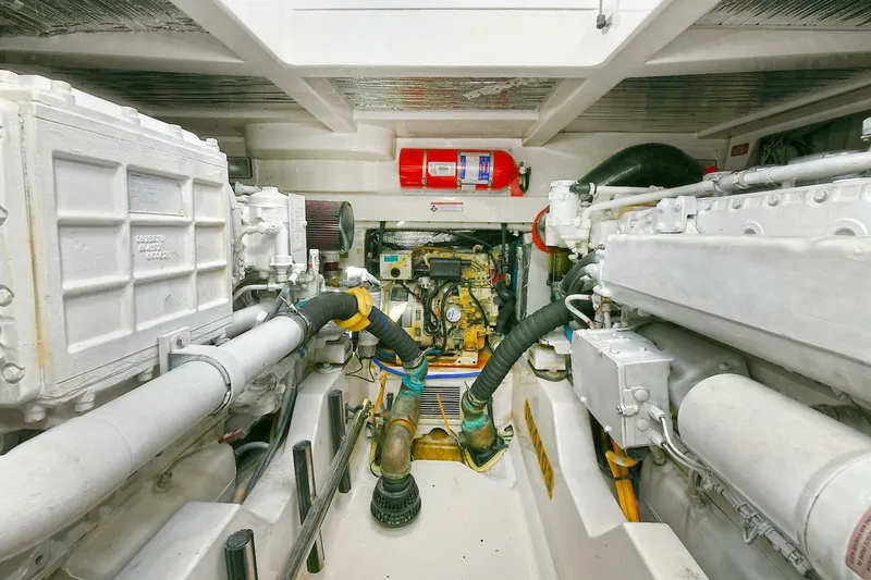 Slide: The Image of Engine room of 2007 Cabo 40 Express with Tower, showcasing mechanical components and control panel. - 27