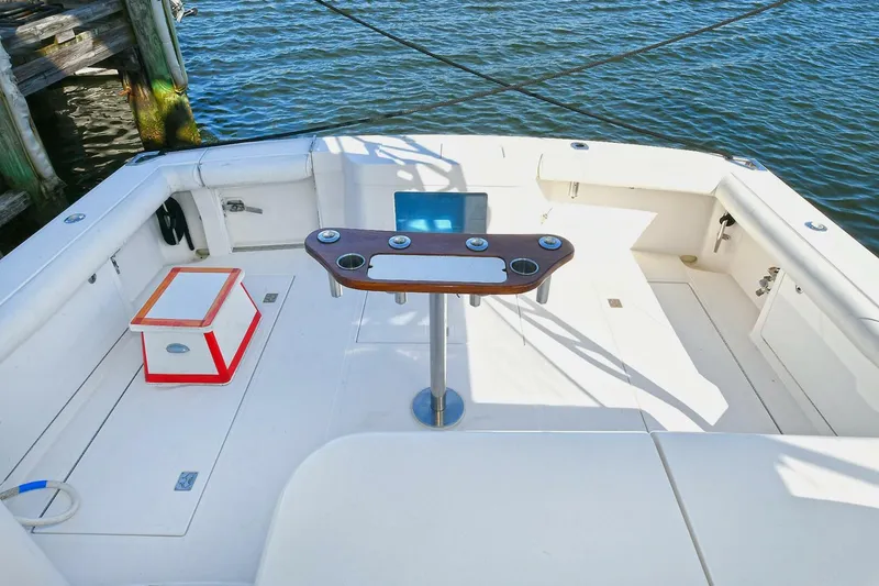 Slide: The Image of 2007 Cabo 40 Express with Tower, showcasing sleek design and spacious deck under clear blue sky. - 5