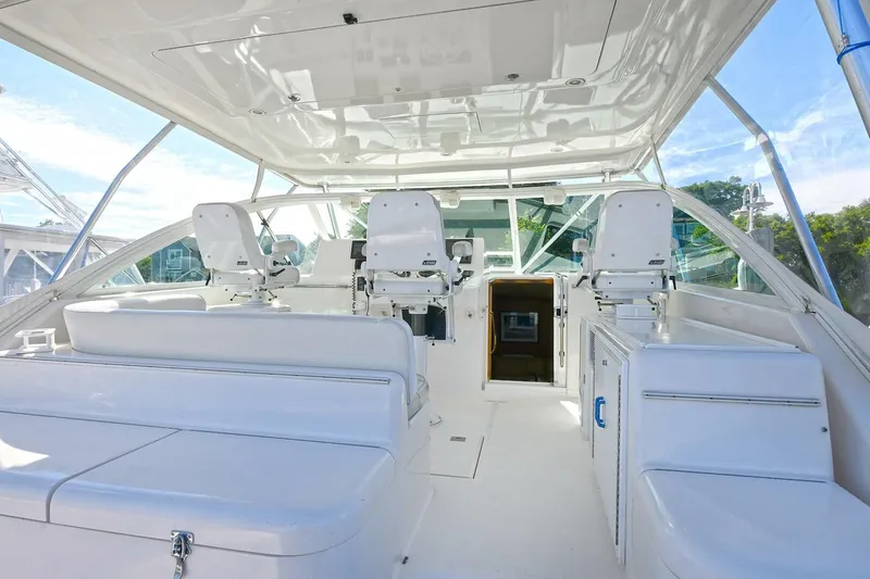 Slide: The Image of 2007 Cabo 40 Express boat interior with open storage drawers and cabinets. - 9