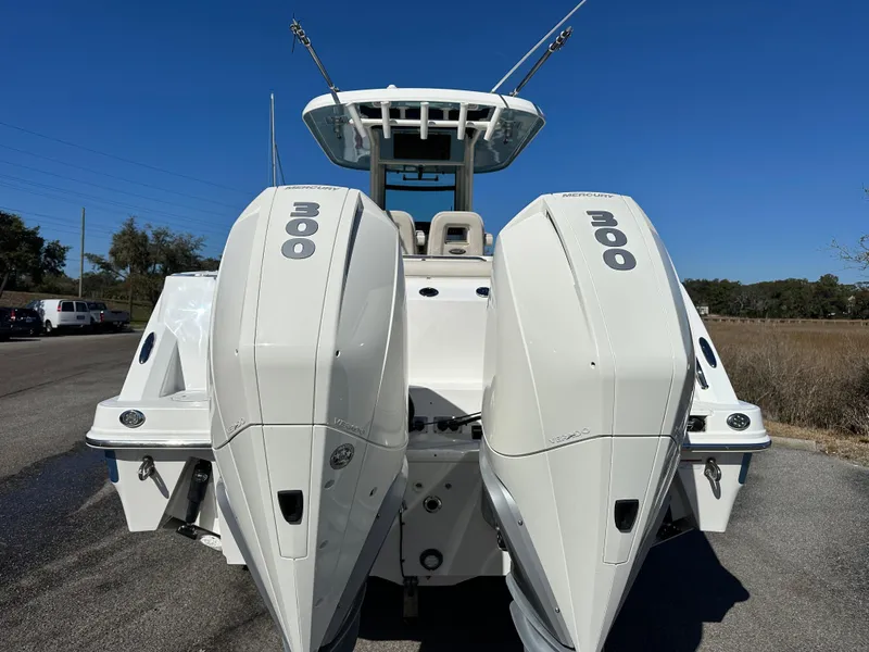 Slide: The Image of 2023 Boston Whaler 280 Outrage with dual 300 horsepower engines, rear view. - 13