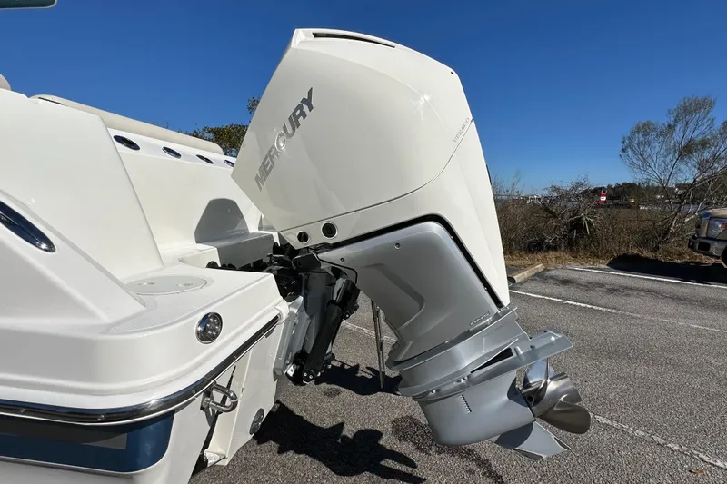 Slide: The Image of 2023 Boston Whaler 280 Outrage with Mercury outboard motor, parked on a sunny day. - 15