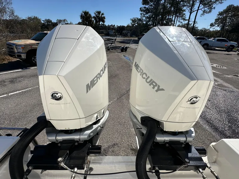 Slide: The Image of Twin Mercury outboard engines on a 2023 Boston Whaler 280 Outrage boat. - 16