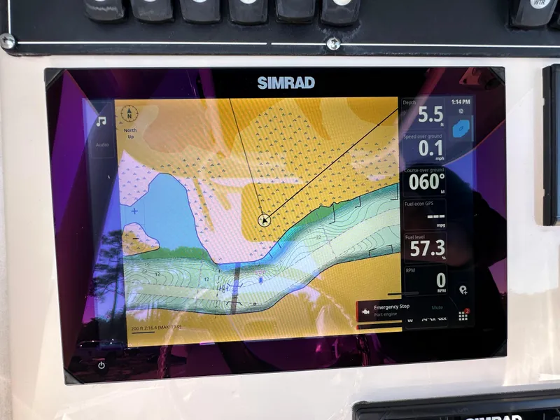 Slide: The Image of Simrad navigation display on 2023 Boston Whaler 280 Outrage boat, showing nautical chart and data. - 19
