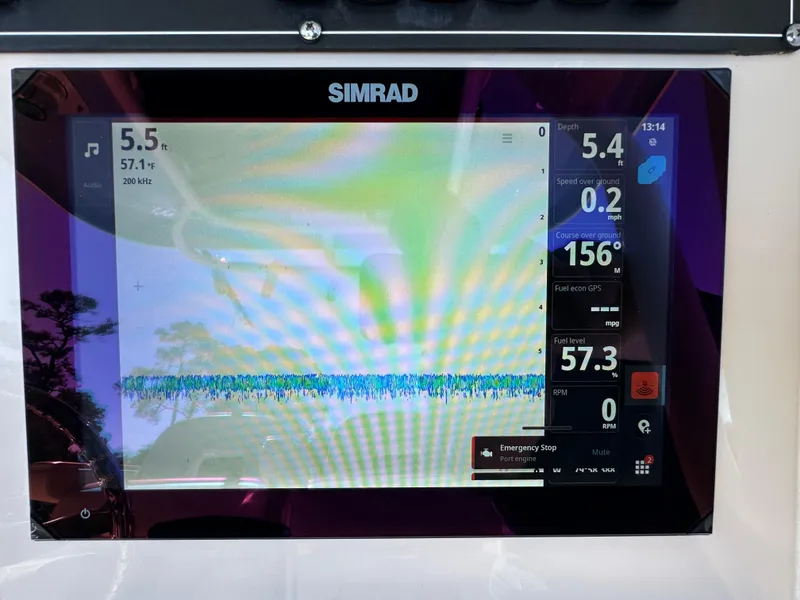 Slide: The Image of Simrad display on 2023 Boston Whaler 280 Outrage showing navigation and performance data. - 20