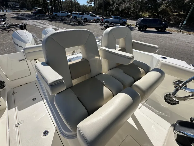 Slide: The Image of 2023 Boston Whaler 280 Outrage boat interior with plush seating and modern design. - 23