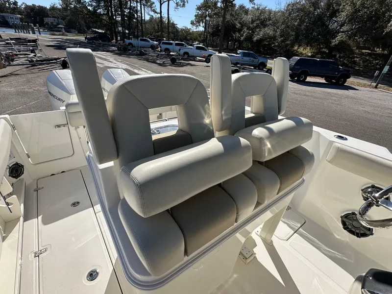 Slide: The Image of 2023 Boston Whaler 280 Outrage boat seats, featuring plush white upholstery and modern design. - 24
