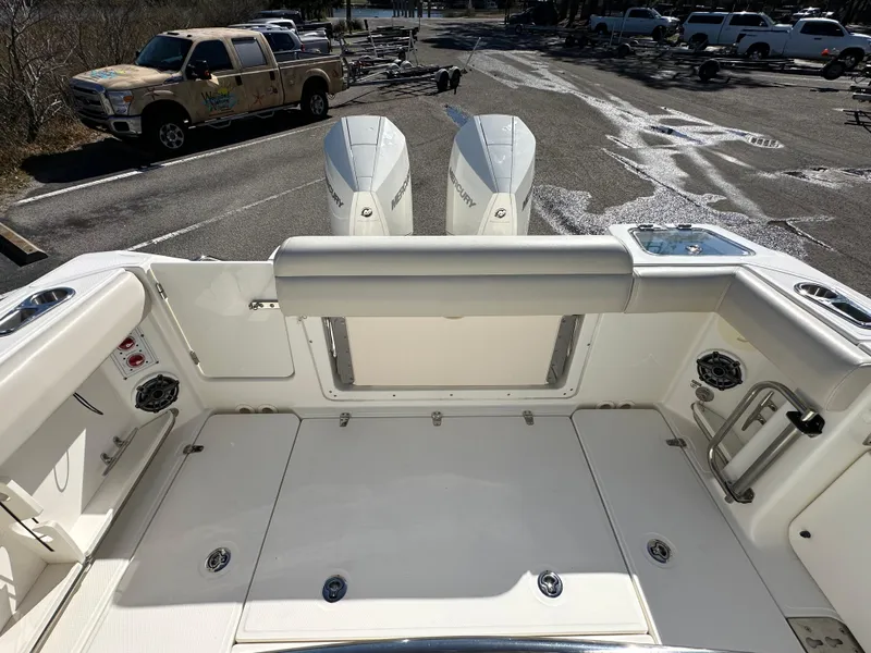 Slide: The Image of 2023 Boston Whaler 280 Outrage boat interior with dual engines and spacious deck. - 34