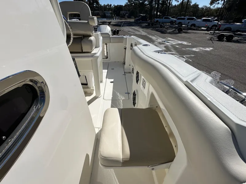 Slide: The Image of 2023 Boston Whaler 280 Outrage boat interior with seating and console view. - 38