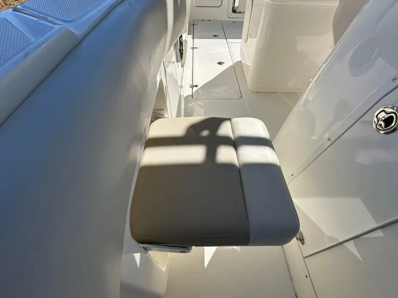 Slide: The Image of 2023 Boston Whaler 280 Outrage interior with cushioned seating and sleek design. - 39