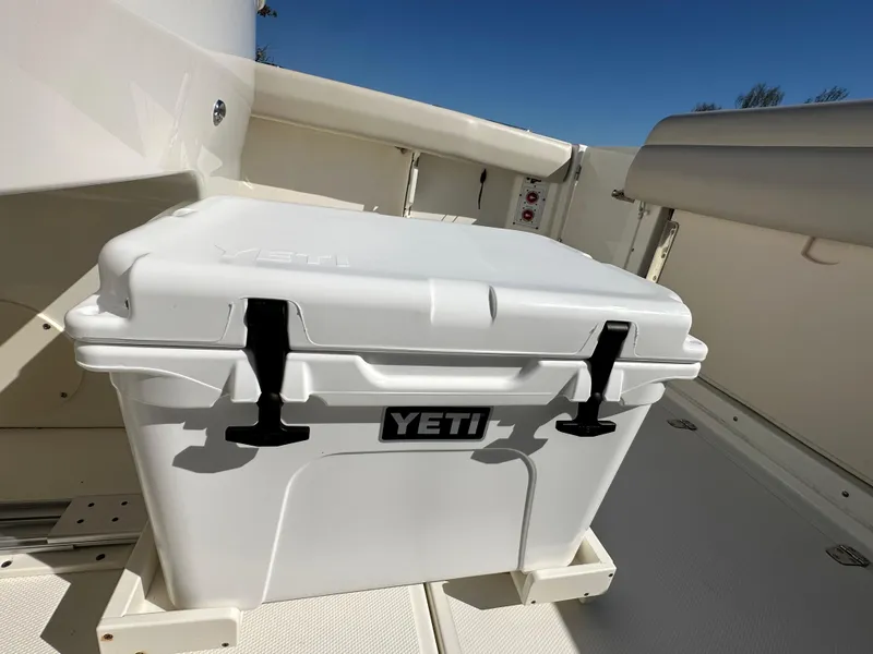Slide: The Image of White YETI cooler on 2023 Boston Whaler 280 Outrage boat deck. - 42