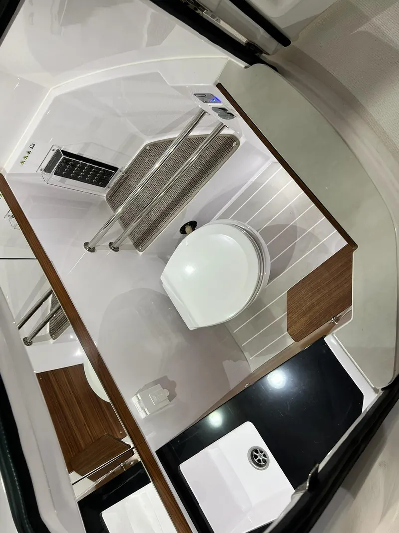 Slide: The Image of Interior of 2022 Axopar 28 CABIN boat bathroom with modern fixtures. - 22