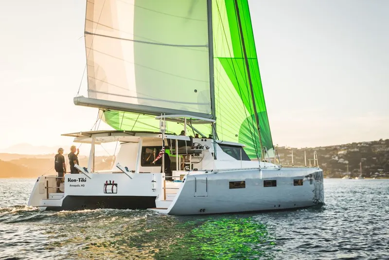 The Image of Sailing catamaran Vision 444, 2026 model, with green sails on a sunny day. - 0