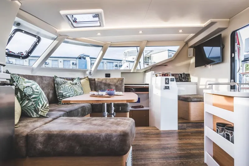 Slide: The Image of Luxurious Vision 444 yacht interior, 2026 model, featuring modern seating and elegant design. - 17