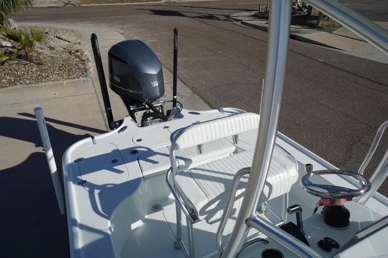 Slide: The Image of 2015 Yellowfin 24 Bay boat with Yamaha outboard motor, docked on a sunny day. - 11