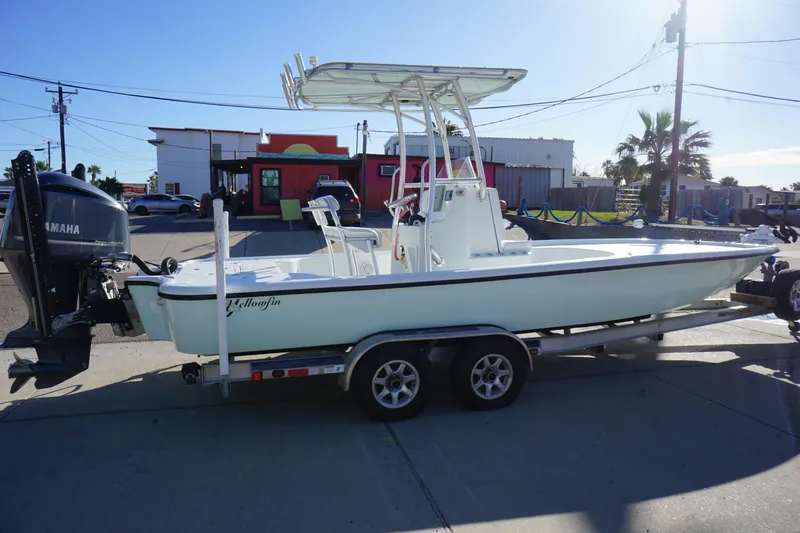 Slide: The Image of 2015 Yellowfin 24 Bay boat on trailer, parked outdoors. - 2