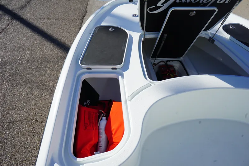 Slide: The Image of 2015 Yellowfin 24 Bay boat storage compartment with safety gear and equipment. - 20