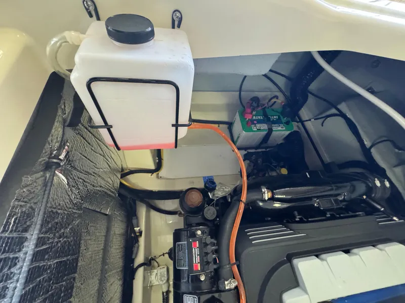 Slide: The Image of Engine compartment of 2025 Chris-Craft Sportster 28 with visible components and wiring. - 13