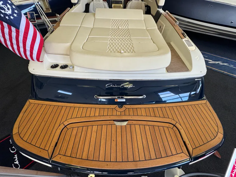 Slide: The Image of 2025 Chris-Craft Sportster 28 boat with elegant teak deck and luxurious seating. - 2