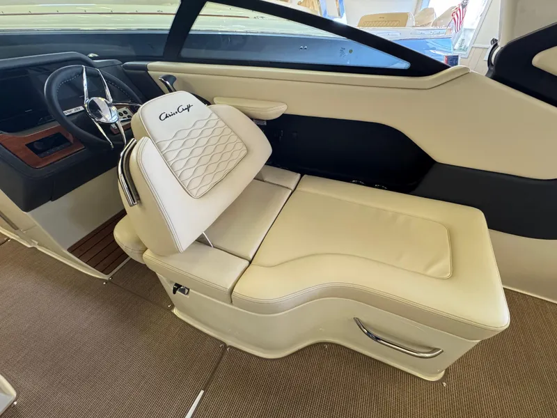 Slide: The Image of 2025 Chris-Craft Sportster 28 interior with luxurious beige seating and modern dashboard design. - 20