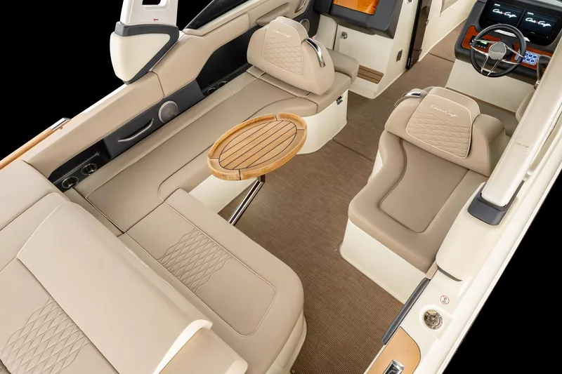 Slide: The Image of 2025 Chris-Craft Sportster 28 interior with beige leather seating and wooden accents. - 39