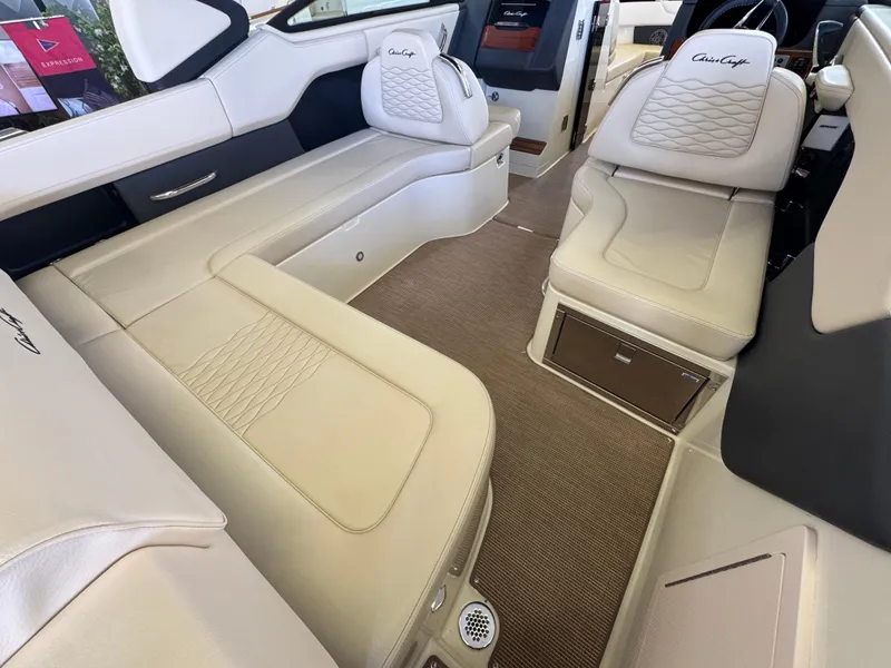 Slide: The Image of Luxurious interior of 2025 Chris-Craft Sportster 28 with beige leather seating. - 6