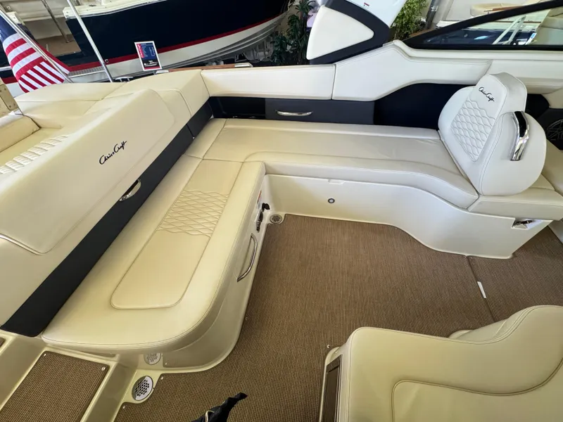 Slide: The Image of 2025 Chris-Craft Sportster 28 interior with luxurious beige seating and elegant design. - 7
