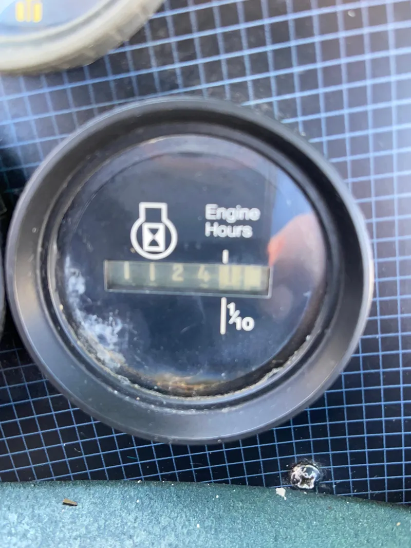 Slide: The Image of Engine hour meter showing 1124.1 hours on 1987 Sea Ray 300 Sedan Bridge. - 28