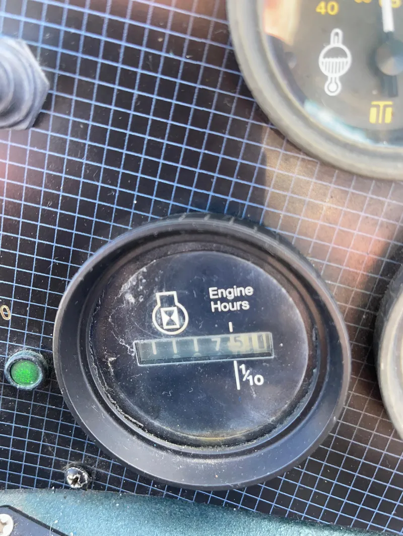 Slide: The Image of 1987 Sea Ray 300 Sedan Bridge engine hours gauge displaying 1751 hours. - 29