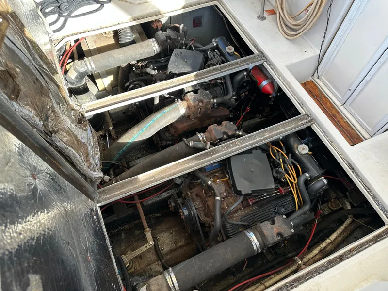 Slide: The Image of Engine compartment of a 1987 Sea Ray 300 Sedan Bridge boat, showing dual engines. - 30