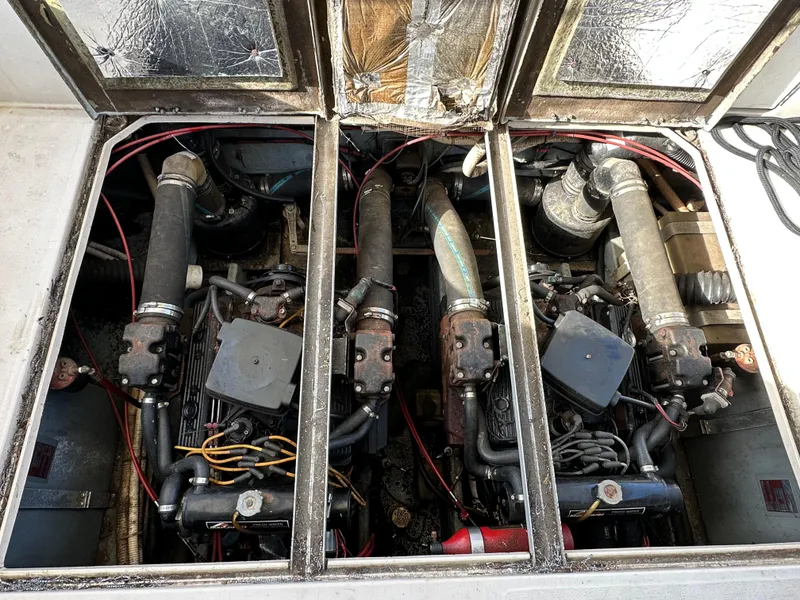 Slide: The Image of Engine compartment of a 1987 Sea Ray 300 Sedan Bridge, showcasing dual engines and components. - 31