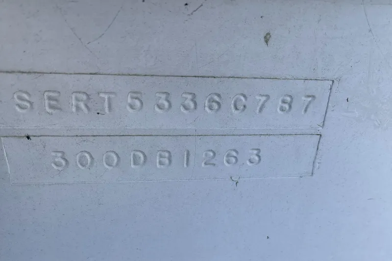 Slide: The Image of 1987 Sea Ray 300 Sedan Bridge hull identification number embossed on surface. - 32