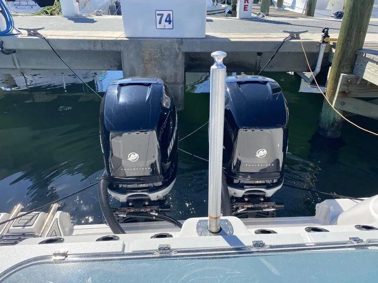 Slide: The Image of Twin outboard engines on a 2022 Sea Fox 328 Commander at a dock. - 12