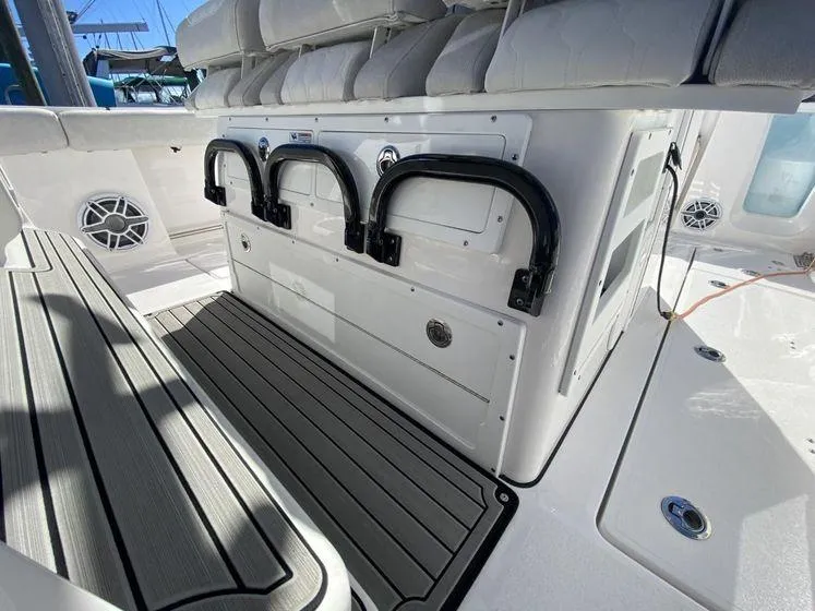 Slide: The Image of 2022 Sea Fox 328 Commander boat interior with cushioned seating and storage compartments. - 20