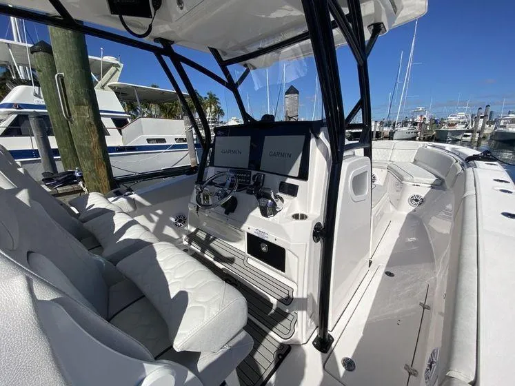 Slide: The Image of 2022 Sea Fox 328 Commander boat interior with dual Garmin displays at marina. - 21