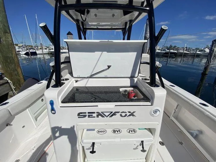 Slide: The Image of 2022 Sea Fox 328 Commander boat interior with open storage compartment at marina. - 32