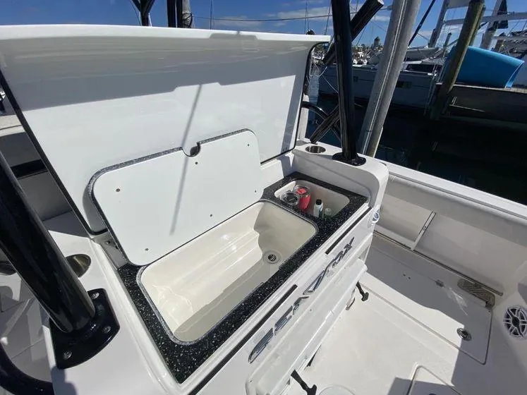 Slide: The Image of 2022 Sea Fox 328 Commander boat interior with open storage compartment. - 33