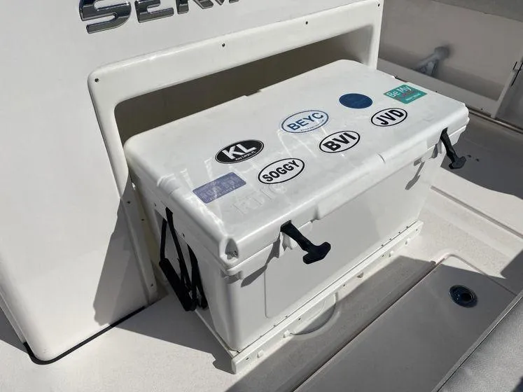 Slide: The Image of White cooler with stickers on a 2022 Sea Fox 328 Commander boat. - 36