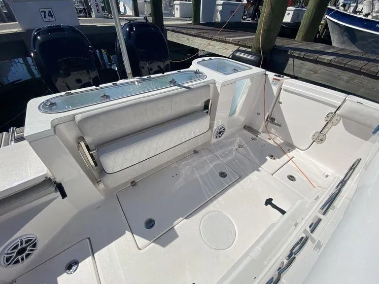 Slide: The Image of 2022 Sea Fox 328 Commander boat deck with seating and storage. - 37