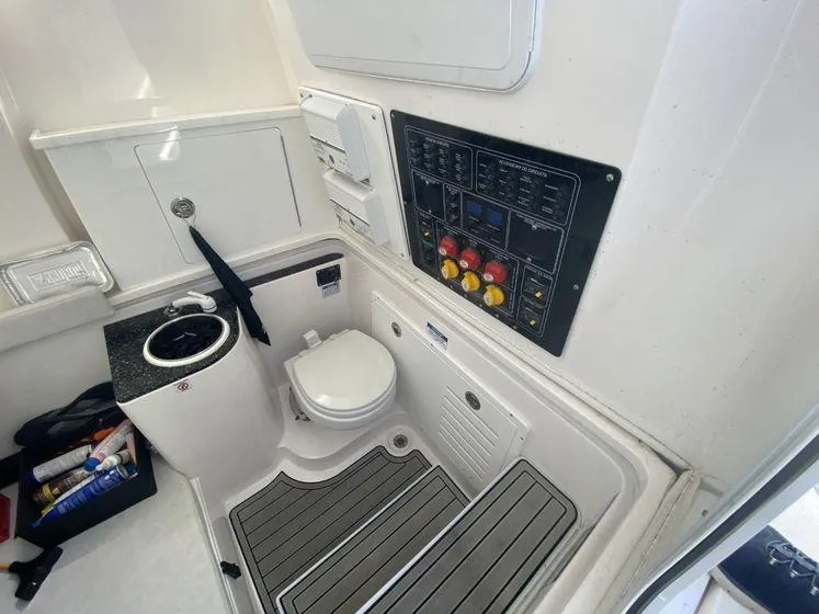 Slide: The Image of 2022 Sea Fox 328 Commander boat interior with control panel and toilet. - 39